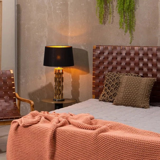 Front view of a vintage-inspired strap woven leather headboard featuring scandinavian design .