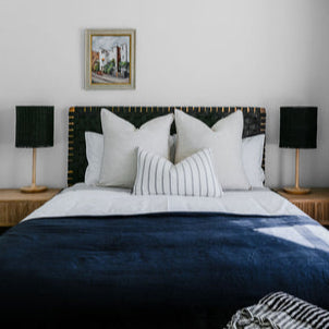 Front view of a classic strap woven leather headboard showcasing its timeless design Black leather.