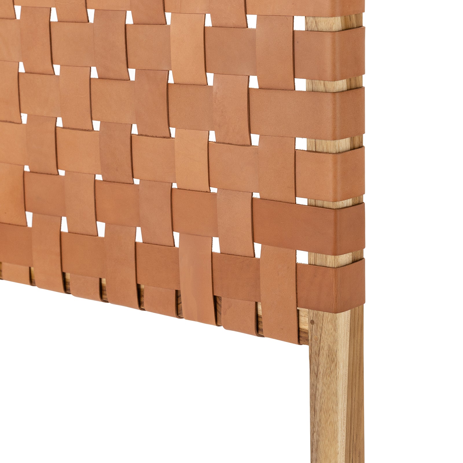 Detailed focus on the texture of the leather straps in a Scandinavian woven headboard.