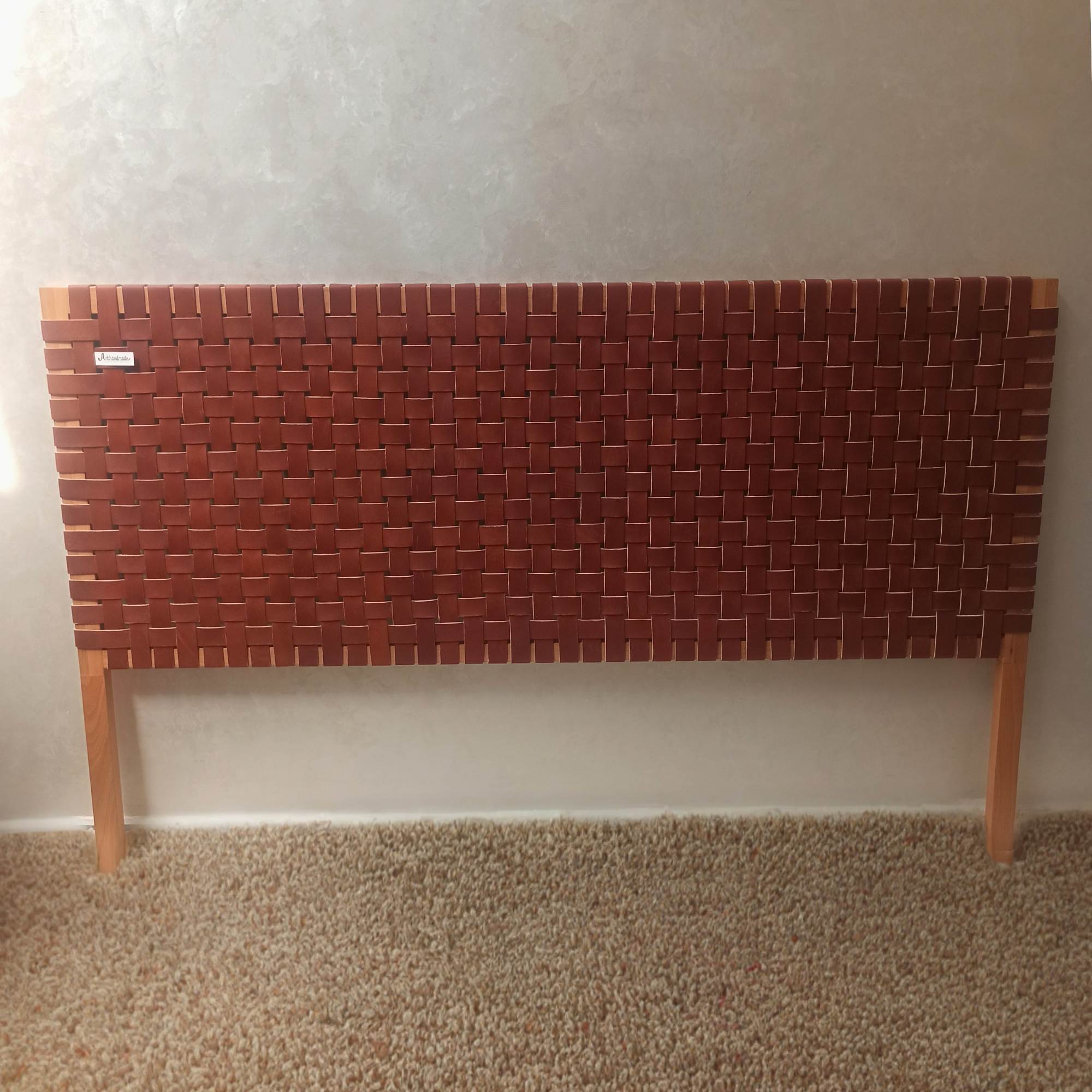 Artihandmade® handcrafted leather headboard for a luxurious bedroom.