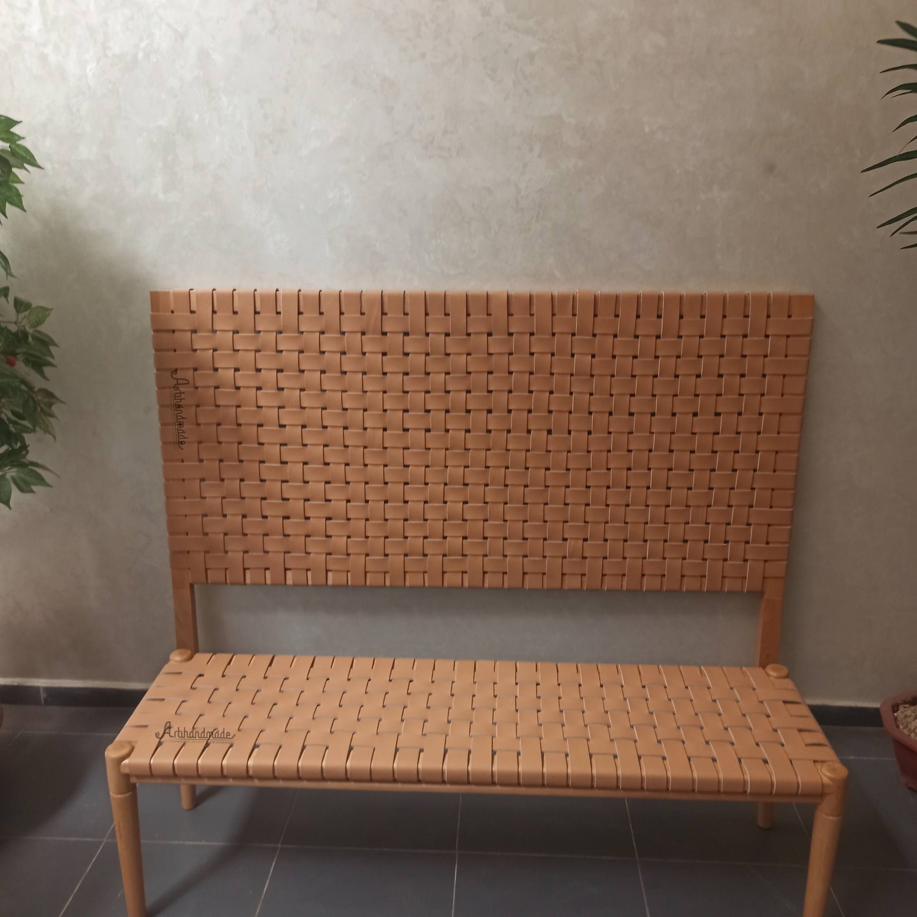 Wall-mounted leather headboard with matching bench, handcrafted from teak and premium leather.