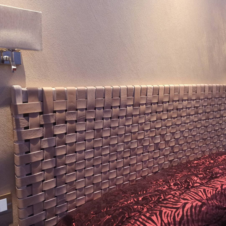 Side angle view of a modern rustic woven strap leather headboard, emphasizing clean lines and premium craftsmanship.