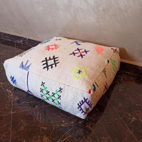 Large, decorative wool poufs, set of two, with a free cushion