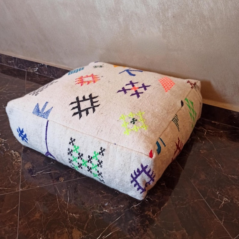 Large, decorative wool poufs, set of two, with a free cushion